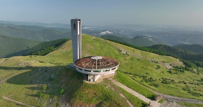 Circular tracking right aerial at sunrise of the Buzludzha Monument, built in 1974 in central Bulgaria by the Bulgarian communist government, abandoned in the 1990s, Bulgaria, Balkan's, Europe