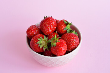 Fresh Strawberries in a Pink Bowl close up