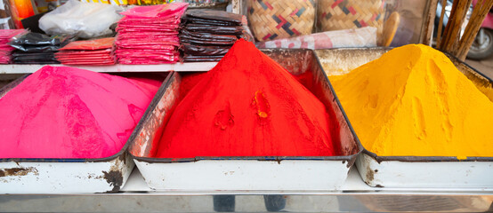 Holi festival India, market stall with colorful powder, celebrating the hindu holiday of colors,...