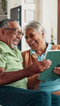 Senior, couple and laughing with tablet in retirement for funny online video, watching comedy movie and bonding. Love, happy people and relax with digital app in home for streaming show or comic blog