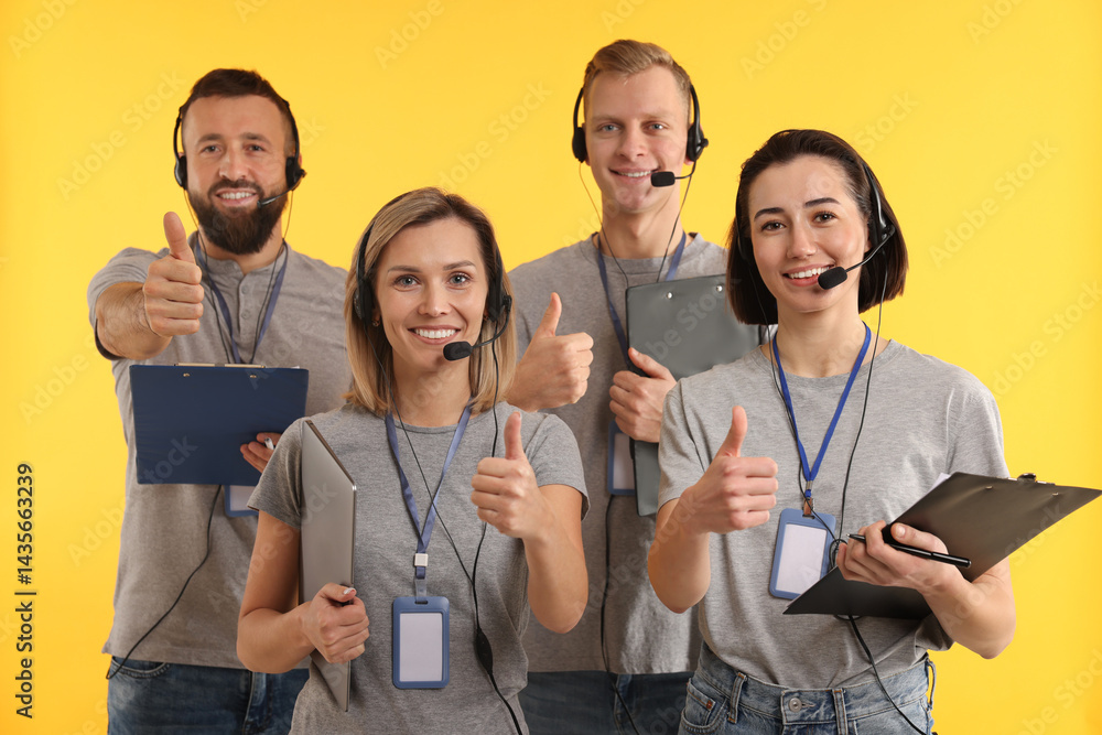 Poster technical support call center. team of friendly operators showing thumbs up on yellow background