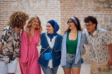 Fototapeta premium Multicultural Teenagers Embracing the Joy of Exploring a Coastal Tourist City on a Sunny Day.