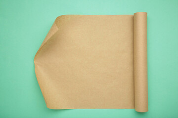 Sheet of baking paper on mint background