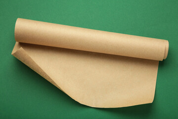 Sheet of baking paper on green background