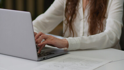 Caucasian business woman employee female manager girl entrepreneur clerk manager businesswoman laptop online studying working typing pc computer tasks browsing internet at office workplace company