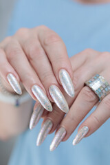 beautiful female hands with long nails light white manicure