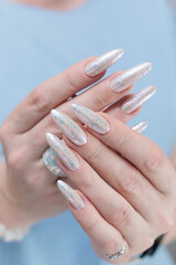 beautiful female hands with long nails light white manicure