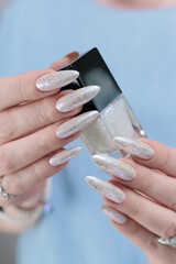 beautiful female hands with long nails light white manicure
