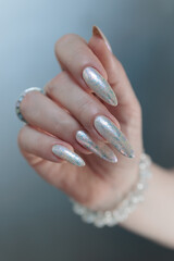 beautiful female hands with long nails light white manicure