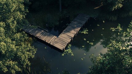 Aerial view of a wooden dock extending into a serene river surrounded by lush greenery on a summer day