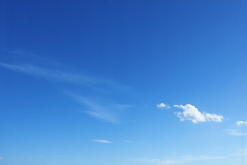 blue sky with some white clouds in it