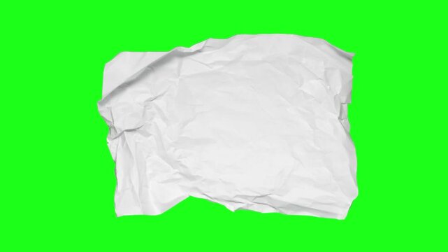 Stop motion animation of crumpled pape on a green background.