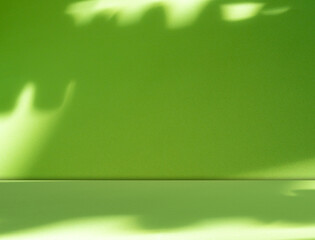 Green background light shadow leaves abstract nature on blur wall cement podium product, studio room floor organic minimal wallpaper backdrop summer tropical platform sale interior empty scene
