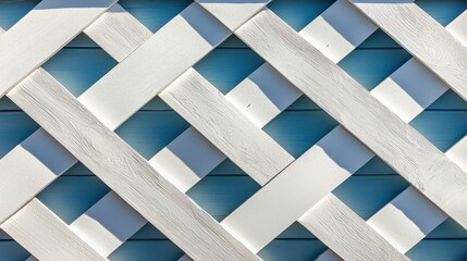 A white lattice fence with blue squares.