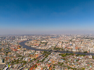Panoramic high view of Bangkok with Chao Phraya River and Khlong San and Phra Nakhon historic districts in the day time