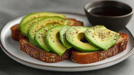 Delicious Avocado Toast with Seasoning on Whole Grain Bread