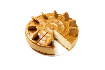 Delicious caramel lotus biscoff cheesecake decorated with biscuits on white background