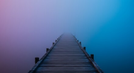 Obraz premium Wooden Pier Stretching into Foggy Water with Colorful Hues