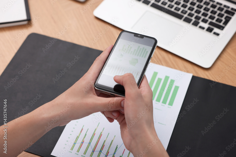 Poster man taking photo of document using scanning app on smartphone at desk in office, closeup