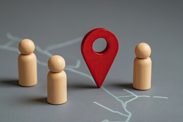 Navigation, people, and destination.  Wooden figurines stand on a map, facing a red location pin