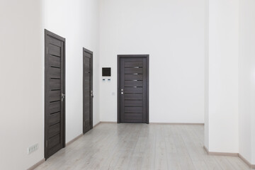 Empty office corridor with white walls and doors. Interior design