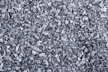 A stone chip gravel footpath surface texture in closeup