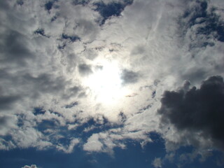 Sunlight Breaking Through White Clouds