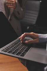 Group of confident business people point to graphs and charts to analyze market data, balance sheet, account, net profit to plan new sales strategies to increase production capacity.