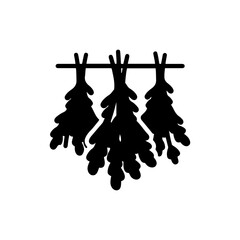 Bundle of Dried Herbs Hanging from a Wooden Rod in the Open Air