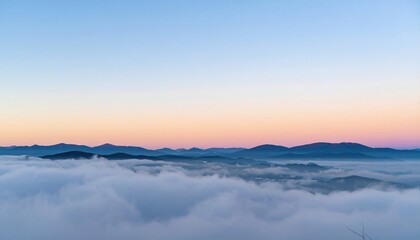 Visual serenity sunrise over misty mountains scenic landscape photography tranquil environment aerial view nature's beauty