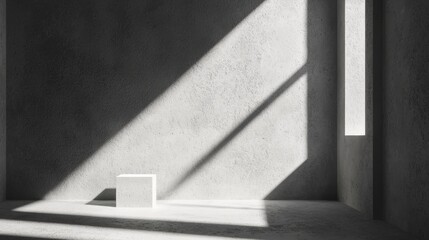 Fototapeta premium A minimalist black and white room with a white cube and a window.