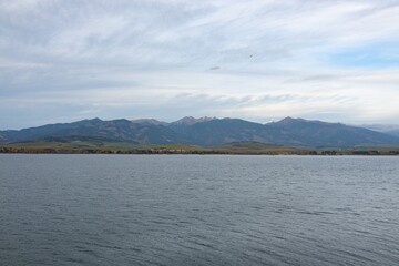 Landscape of Liptovska Mara water dam in Slovakia, High Tatra Mountains in background