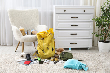 Survival kit. Different emergency supplies on floor indoors