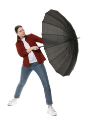Young woman with black umbrella on white background
