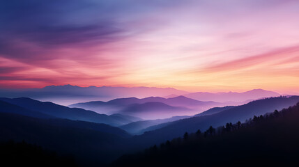 A peaceful mountain sunset with pastel colors in the sky and the silhouettes of distant peaks in the background.