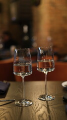 wine glass with white wine on a set table