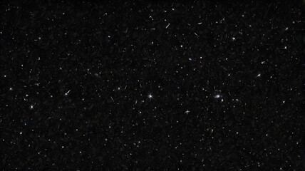 A pure black background sprinkled with tiny specks of light, resembling stars scattered across deep space.