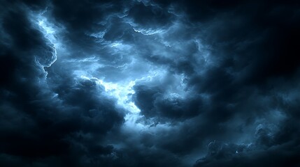Dark, stormy clouds illuminated by lightning