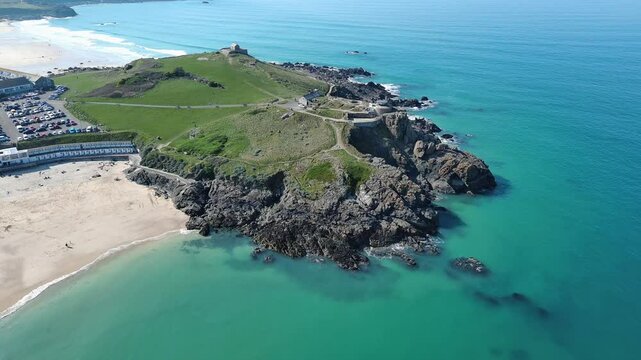 Aerial view of St Ives Head, St Nicholas Chapel and Porthmeor Beach in St Ives town, England