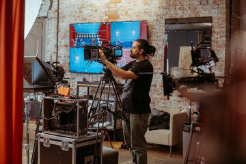 Film set, monitors and modern shooting equipment. Film crew, lighting devices, monitors, playbacks - filming equipment and a team of specialists in filming movies, advertising and TV series