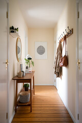 Minimalist Scandinavian Narrow Hallway with Space-Saving Furniture Solutions