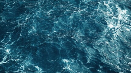 Obraz premium A textured surface of deep blue ocean waves.