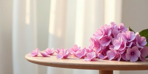 Delicate Pink Blossoms Gracefully Arranged on a Wooden Table near Sheer Curtains in Soft Sunlight