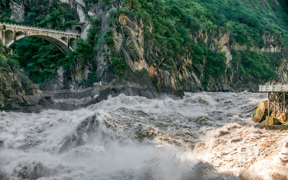 Tiger Leaping Gorge is the canyon with the largest drop in the world. The narrowest part of the Jinsha River is  20 to 30 meters wide, with the huge drop in height, the river is surging and majest
