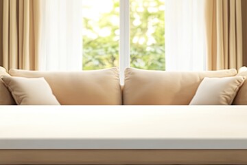 Beige couch, white table, window view