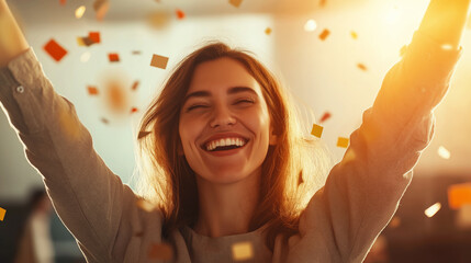 Businesswoman raising arms in victory, celebrating professional achievement with confetti falling, expressing joy and excitement in office environment
