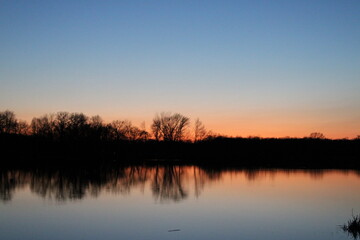 Obraz premium sunset over the river