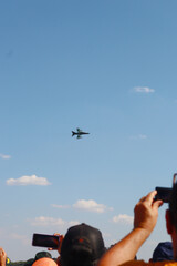Beautiful landscape of a fighter jet flying at an air show

