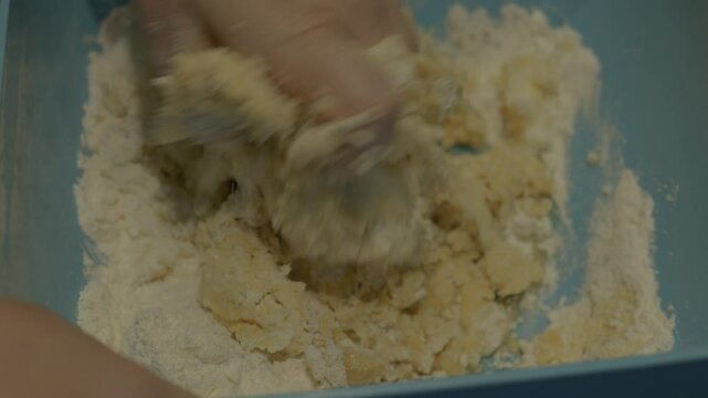 Mixing flour and butter by hand