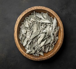 Dried sage herb in a wooden bowl